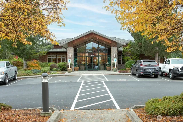 a view of a house with car parked