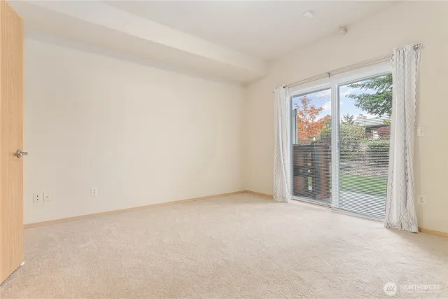 a view of an empty room with a sliding door