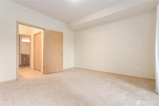 an empty room with closet area