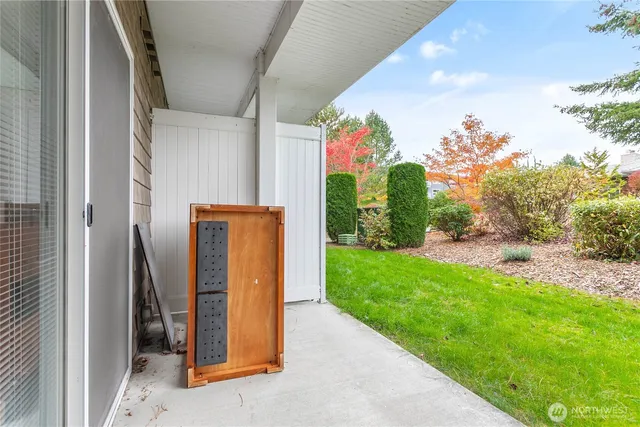 a view of backyard with swimming pool and outdoor seating