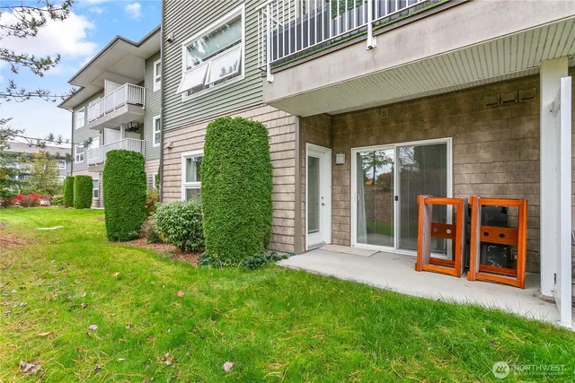 a view of a house with a yard and plants