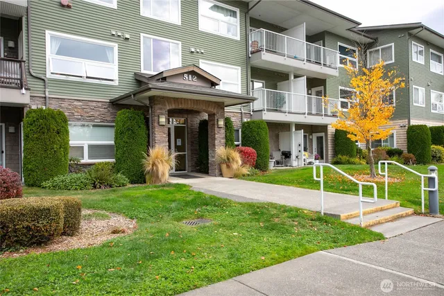 a view of a building with a yard
