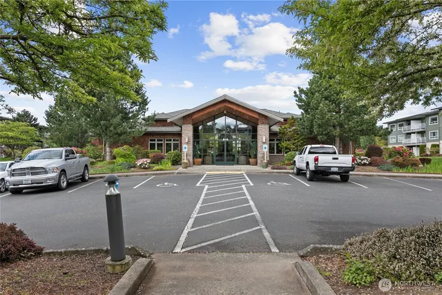 a view of a car parked in front of a house