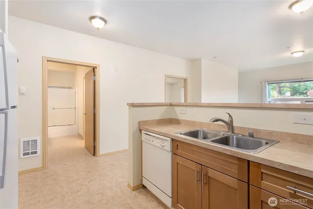 a kitchen with a sink and cabinets