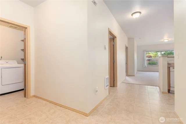 a view of a hallway with bathroom