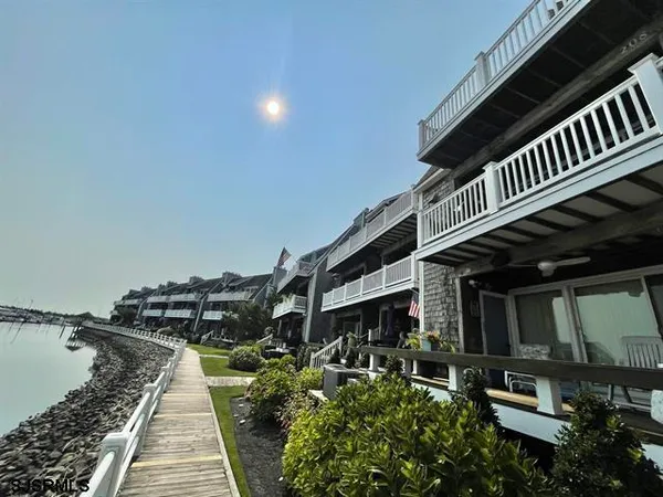 a view of a roof deck with a fence