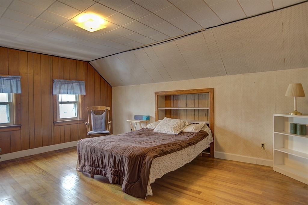 44 Cottage Park Road Winthrop, MA 02152 - Photo 24 of 39 a bedroom with a bed and a window