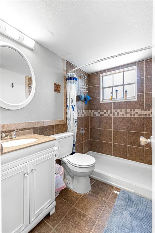 588 Fairways Lane, Unit E201 Ocala, FL 34472 - Photo 21 of 33 a bathroom with a sink a toilet and shower