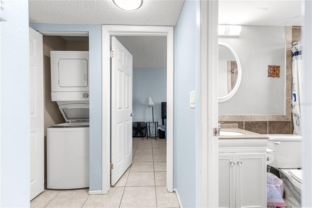 588 Fairways Lane, Unit E201 Ocala, FL 34472 - Photo 23 of 33 view of living room with washer and dryer