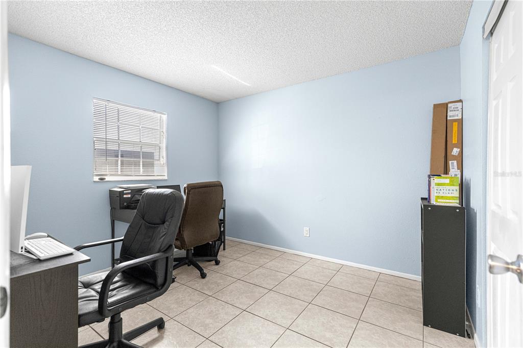 588 Fairways Lane, Unit E201 Ocala, FL 34472 - Photo 27 of 33 a view of workspace with wooden floor windows