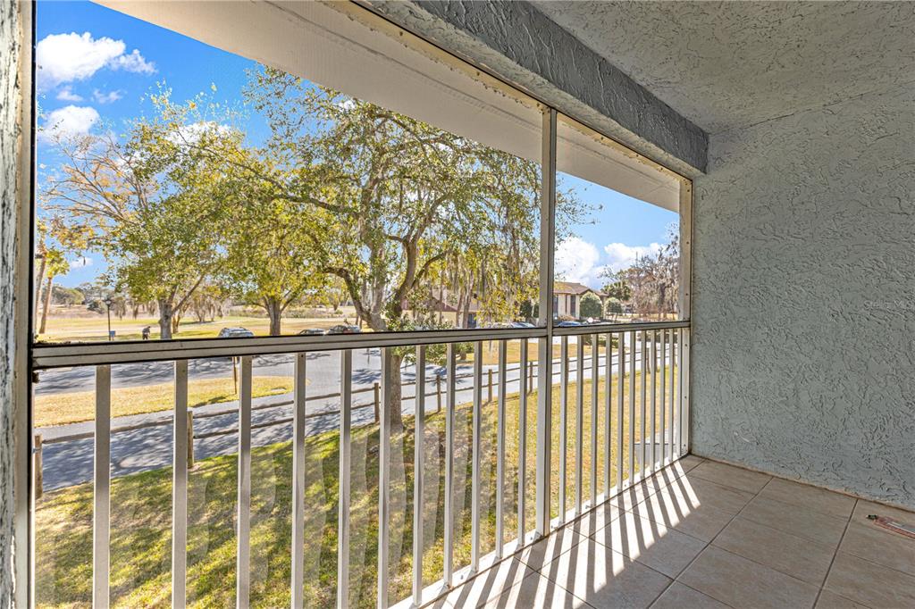 588 Fairways Lane, Unit E201 Ocala, FL 34472 - Photo 30 of 33 a view of a large window with an outdoor space
