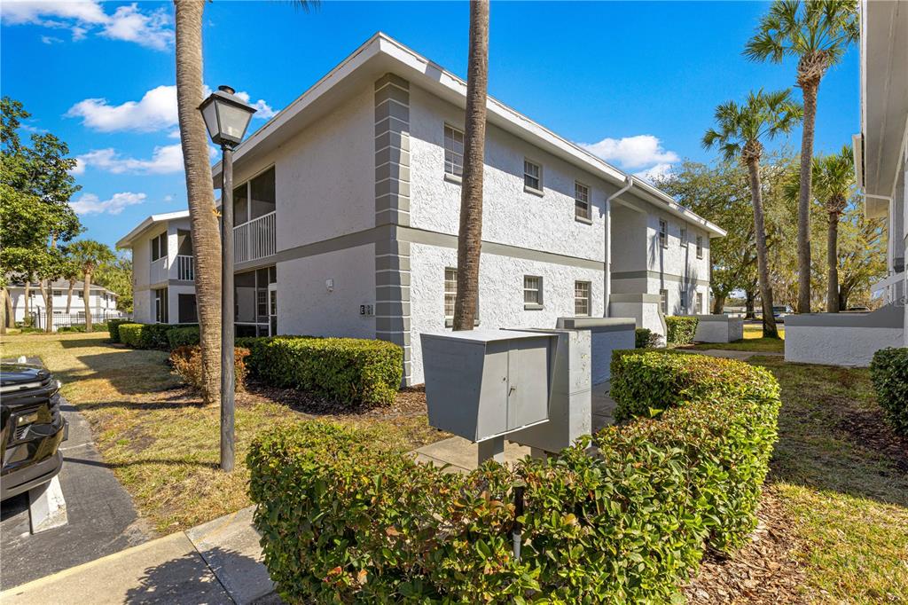 588 Fairways Lane, Unit E201 Ocala, FL 34472 - Photo 31 of 33 a view of a house with a yard