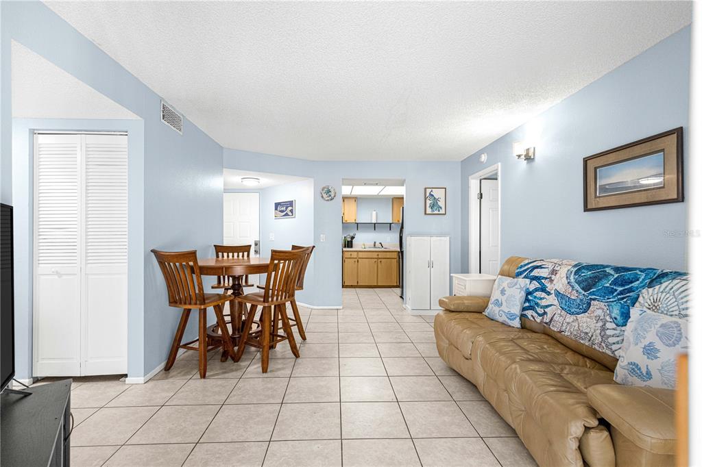 588 Fairways Lane, Unit E201 Ocala, FL 34472 - Photo 7 of 33 a living room with furniture and view of kitchen