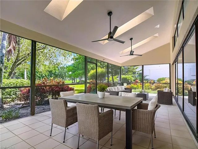 a view of a dining area with furniture window and outside view