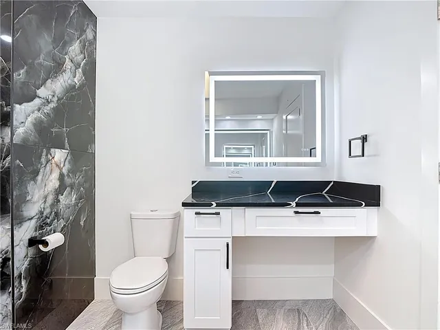 a close view of a sink and a toilet