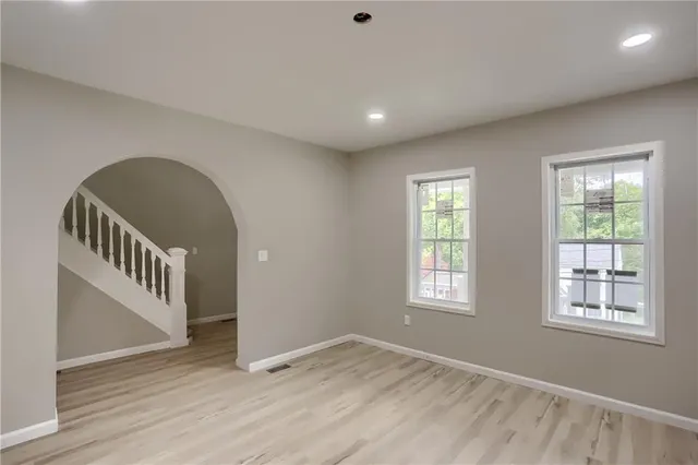 a view of an entryway with wooden floor