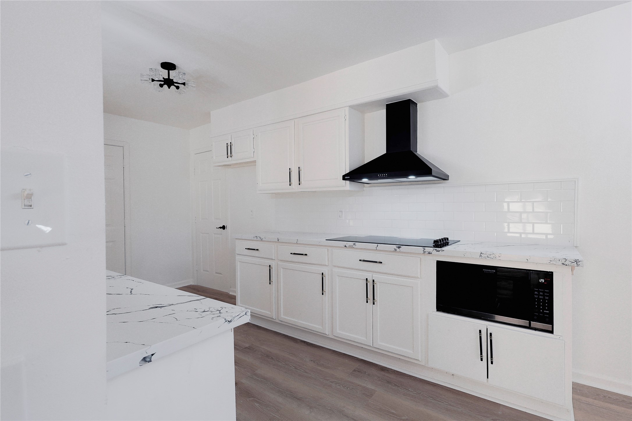 11611 Sagedowne Lane Houston, TX 77089 - Photo 11 of 31 a kitchen with a sink and white cabinets