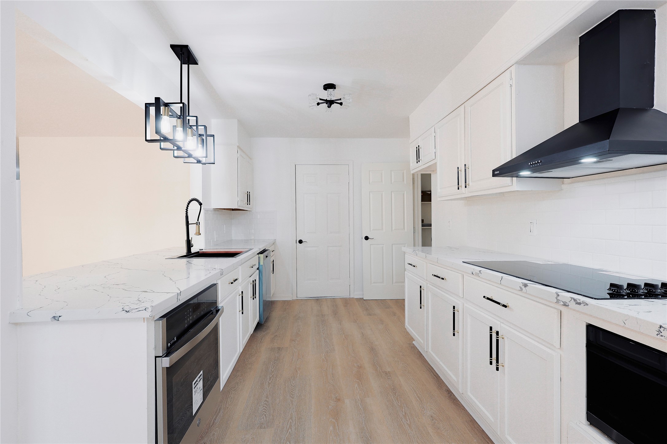 11611 Sagedowne Lane Houston, TX 77089 - Photo 9 of 31 a kitchen with stainless steel appliances a sink stove and cabinets