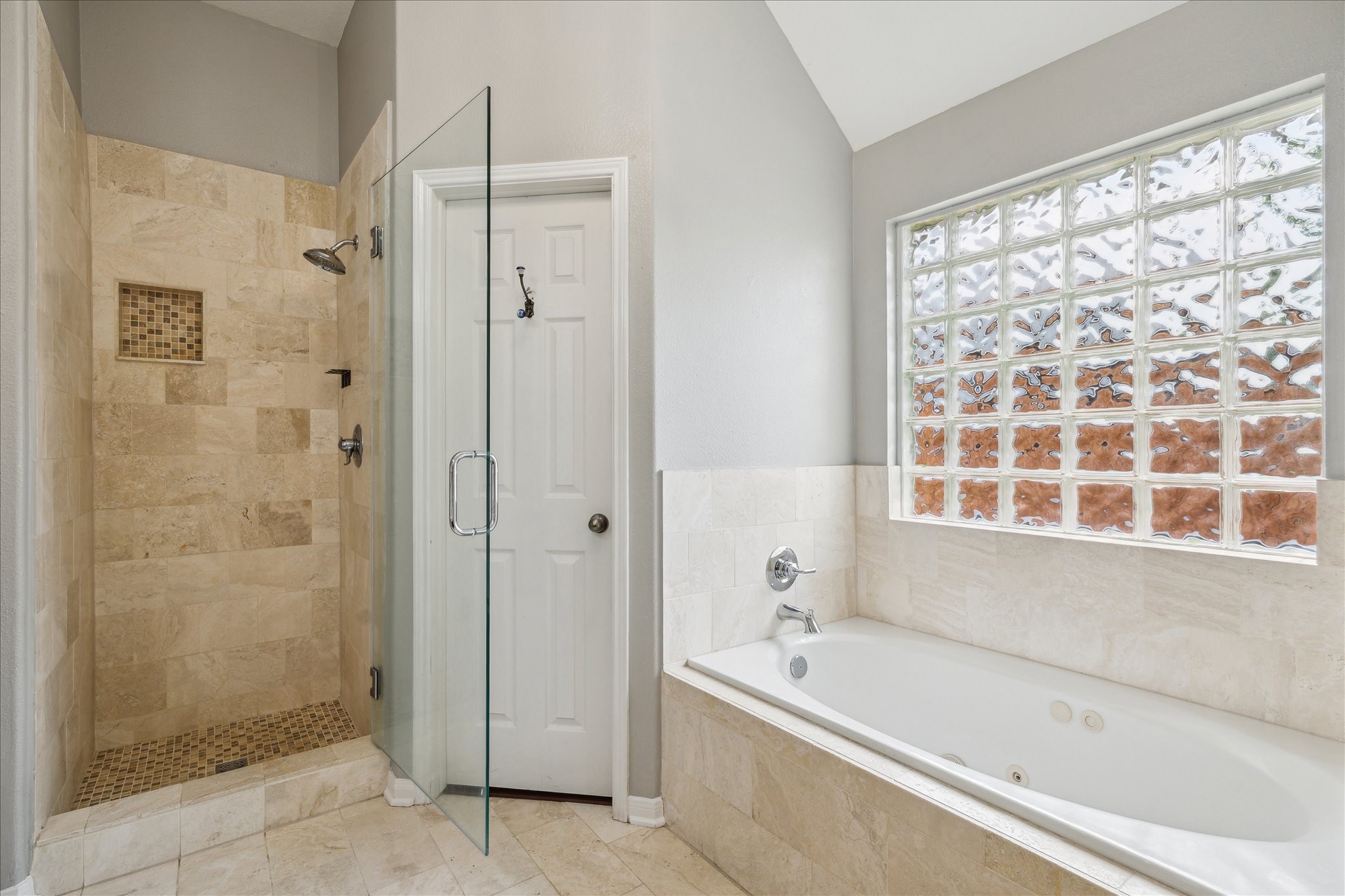 20910 Sandy Briar Court Spring, TX 77379 - Photo 21 of 28 a bathroom with a bathtub and a shower