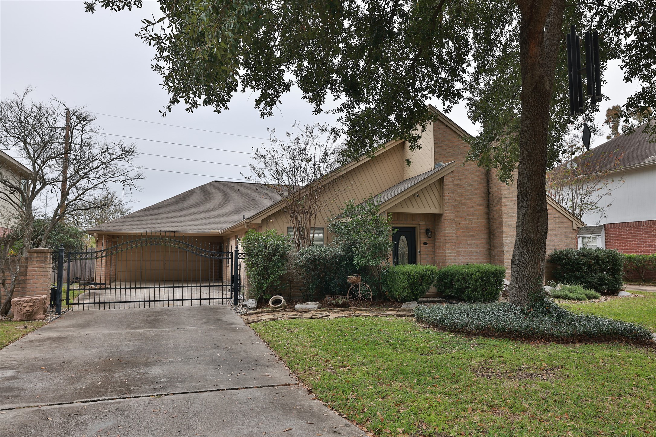 6702 Seinfeld Court Houston, TX 77069 - Photo 33 of 38 a front view of a house with a yard and garage