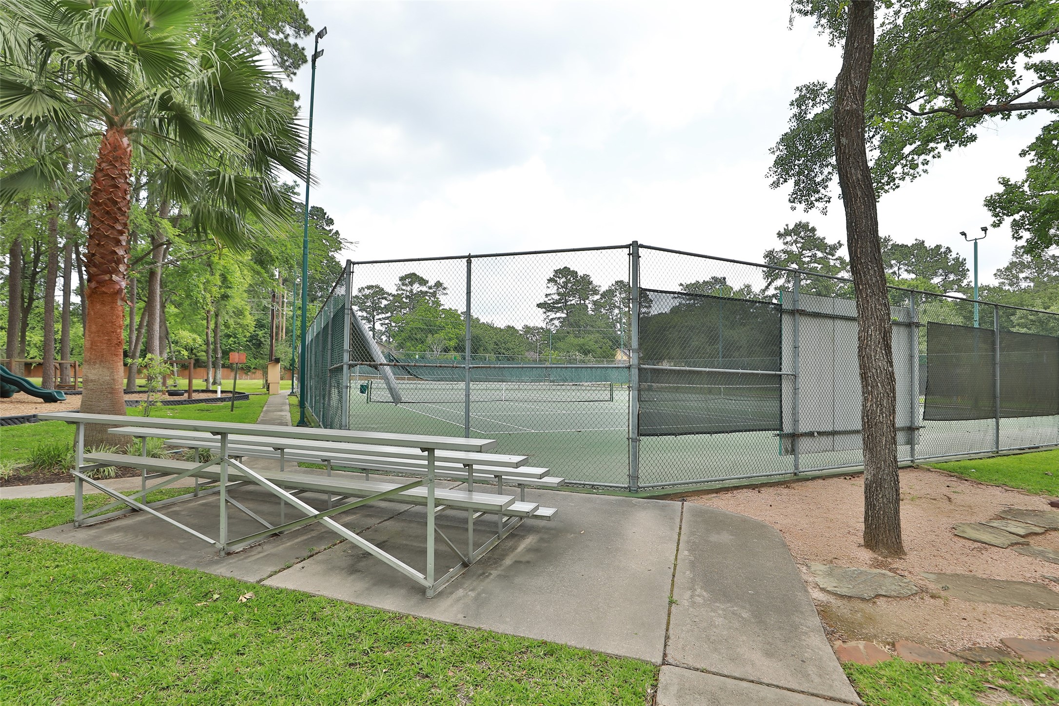 6702 Seinfeld Court Houston, TX 77069 - Photo 36 of 38 a view of a backyard with sitting area and tree s