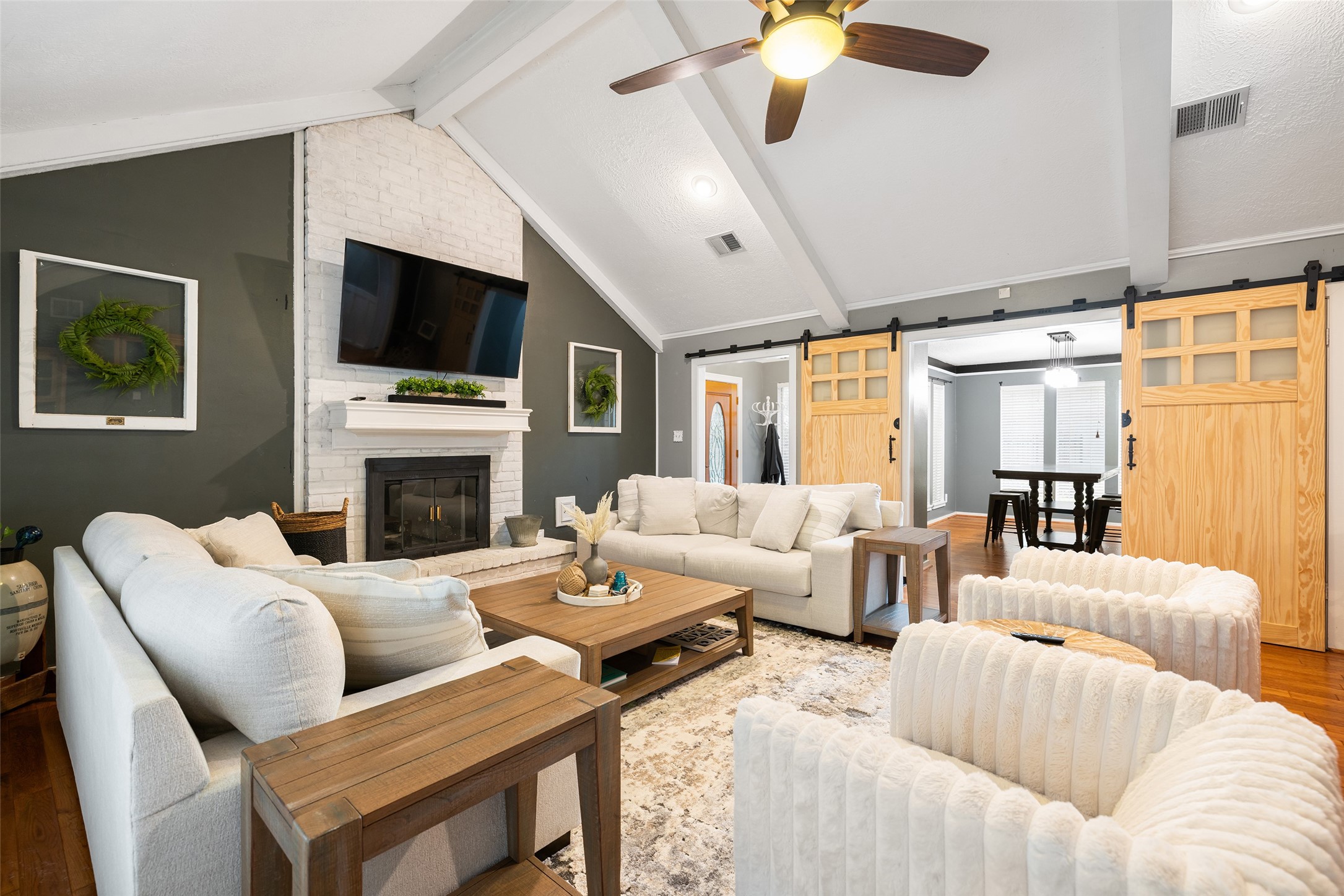 6702 Seinfeld Court Houston, TX 77069 - Photo 4 of 38 a living room with furniture a fireplace and a flat screen tv