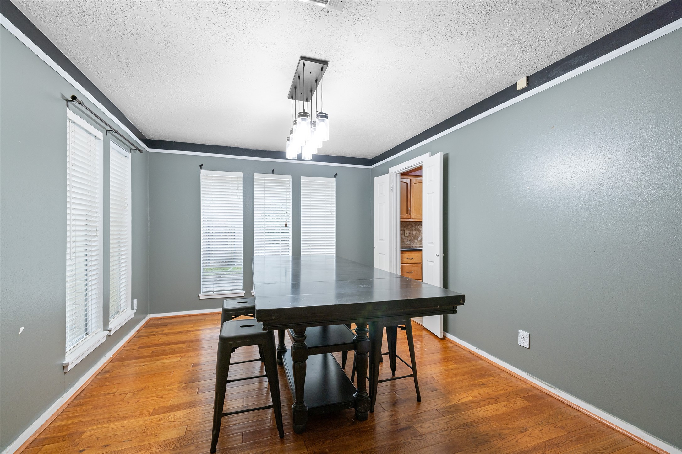 6702 Seinfeld Court Houston, TX 77069 - Photo 9 of 38 a view of a dining room with furniture and wooden floor