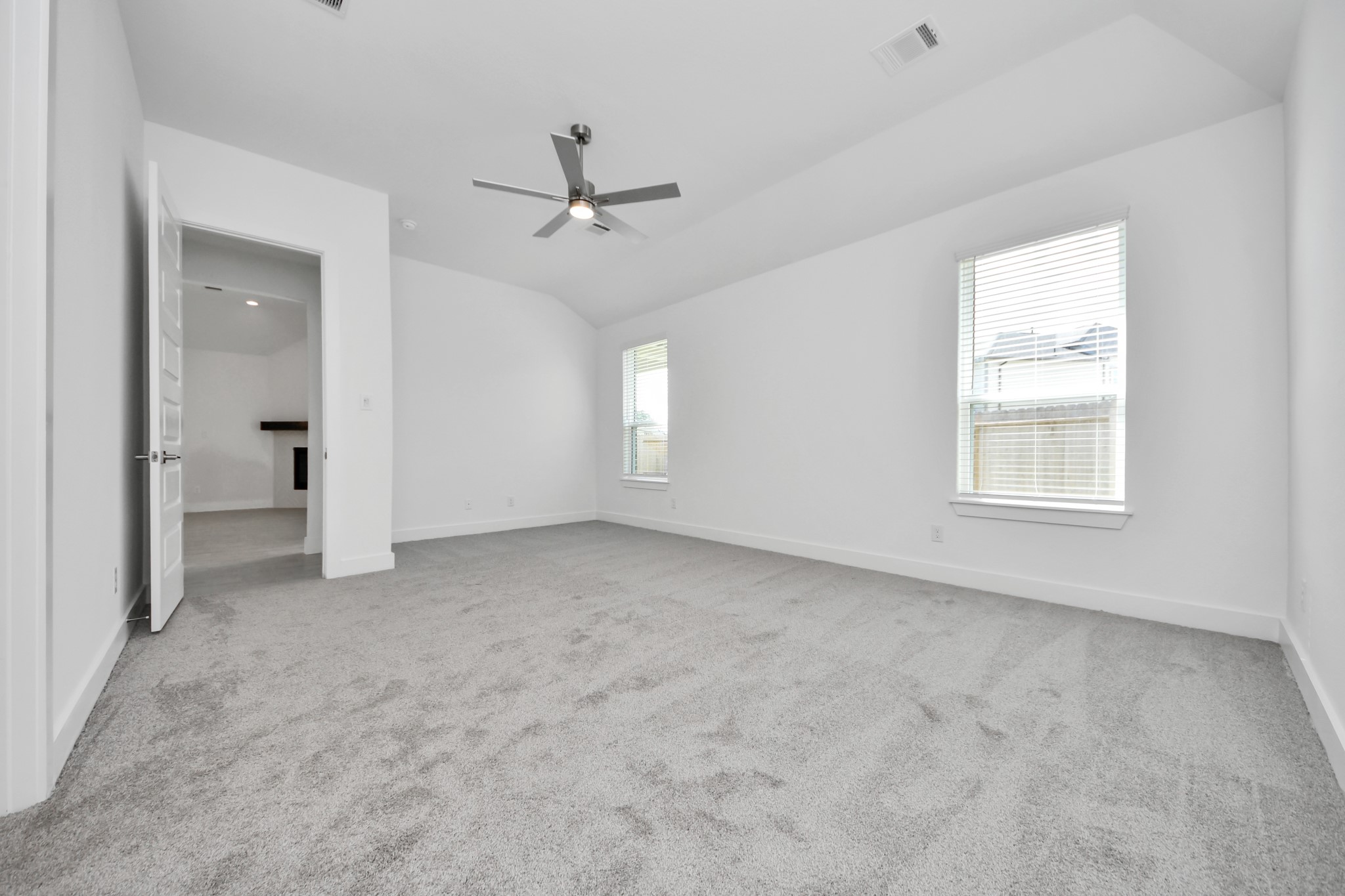 3042 Native Spg Drive Spring, TX 77373 - Photo 29 of 40 Come and unwind after a long day in this magnificent primary suite! This spacious room features plush carpet, warm paint, high ceilings and large windows with privacy blinds.