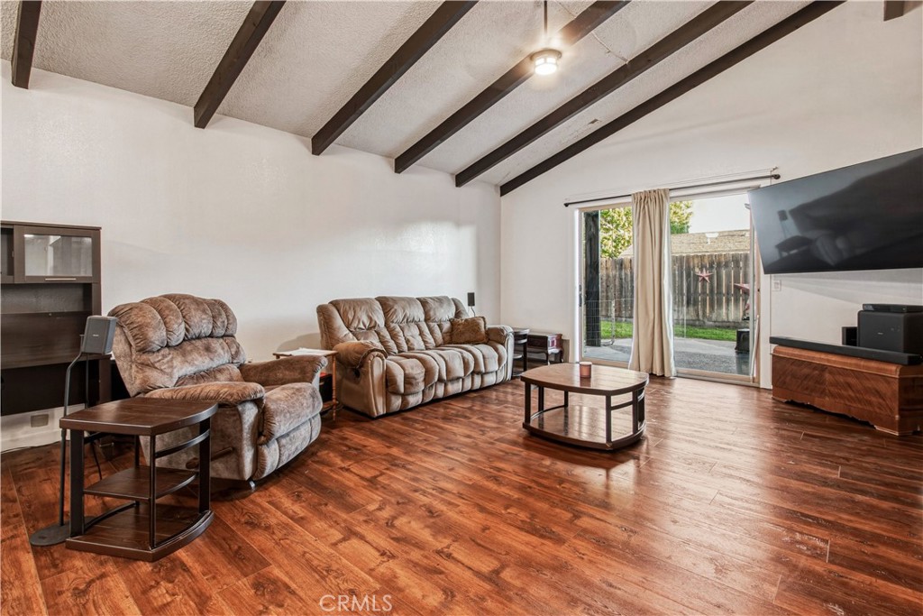 1908 Chelwood Way Modesto, CA 95355 - Photo 12 of 44 a living room with furniture and a flat screen tv