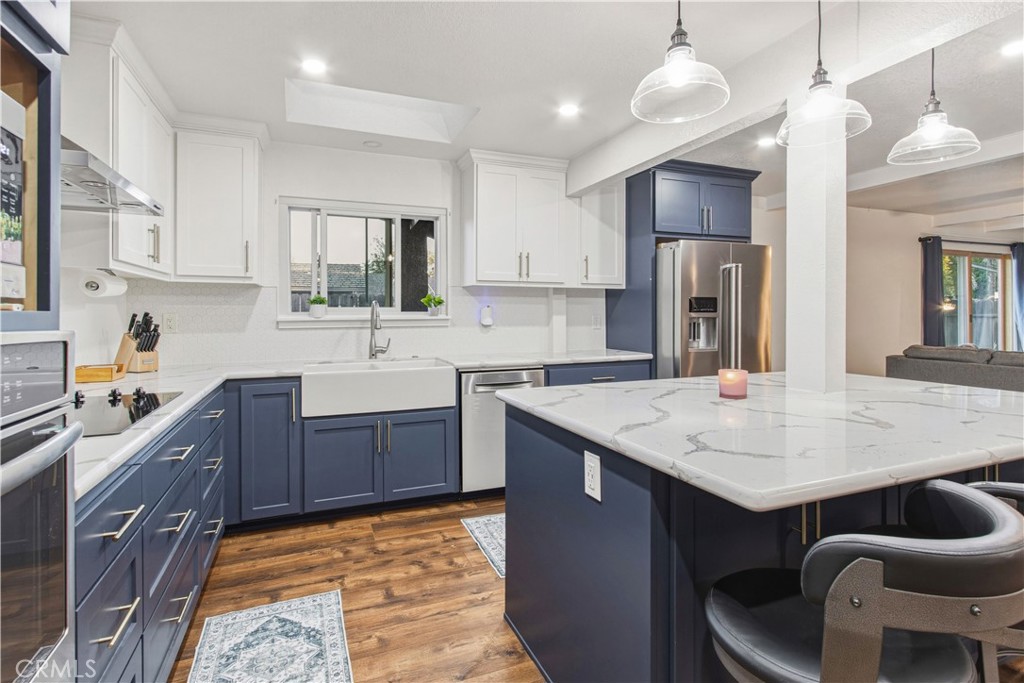 1908 Chelwood Way Modesto, CA 95355 - Photo 17 of 44 a kitchen with sink cabinets and refrigerator