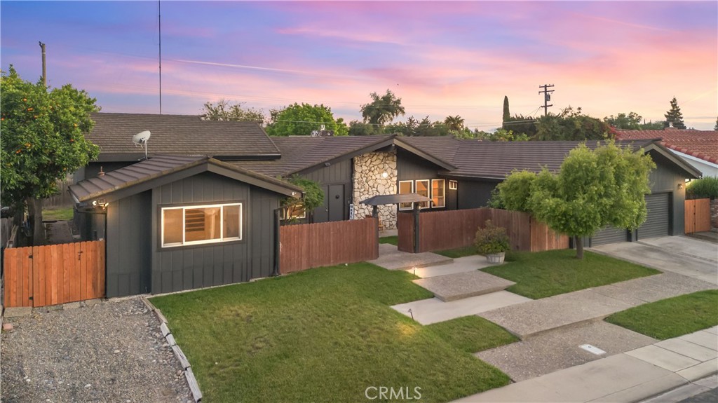 1908 Chelwood Way Modesto, CA 95355 - Photo 2 of 44 a front view of a house with a yard