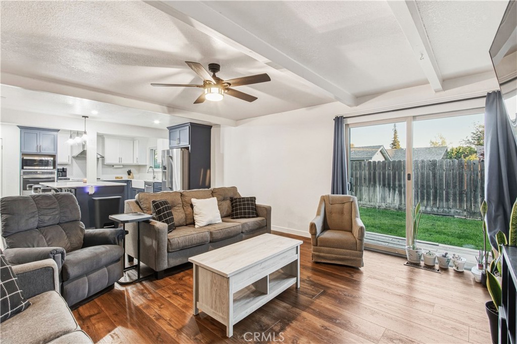 1908 Chelwood Way Modesto, CA 95355 - Photo 21 of 44 a living room with furniture and a large window with outer view