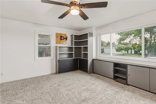 a utility room with cabinets washer and dryer