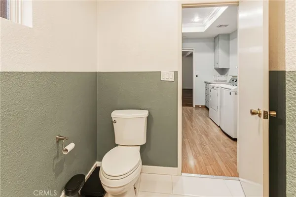 a bedroom with a bed and a ceiling fan