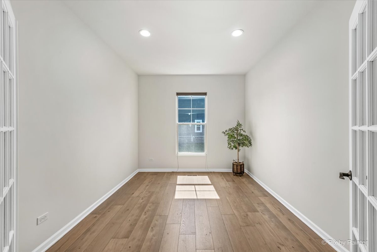 23116 Pinehurst Drive Kildeer, IL 60047 - Photo 11 of 27 a view of empty room with wooden floor and fan