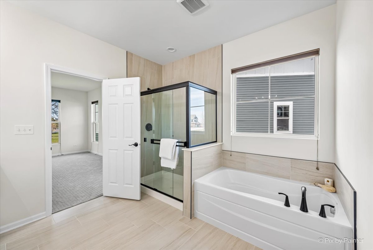 23116 Pinehurst Drive Kildeer, IL 60047 - Photo 17 of 27 a bathroom with a bathtub and a shower