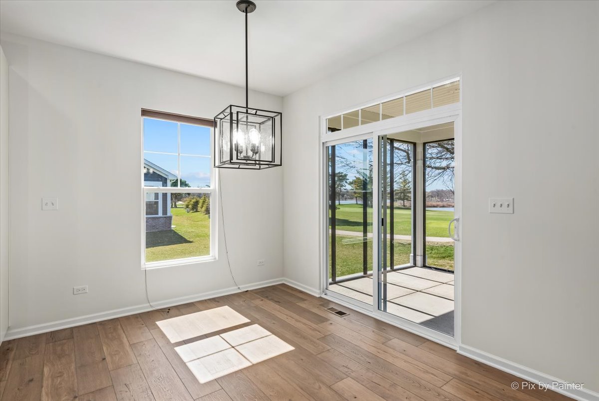 23116 Pinehurst Drive Kildeer, IL 60047 - Photo 9 of 27 a view of an empty room with a window and wooden floor