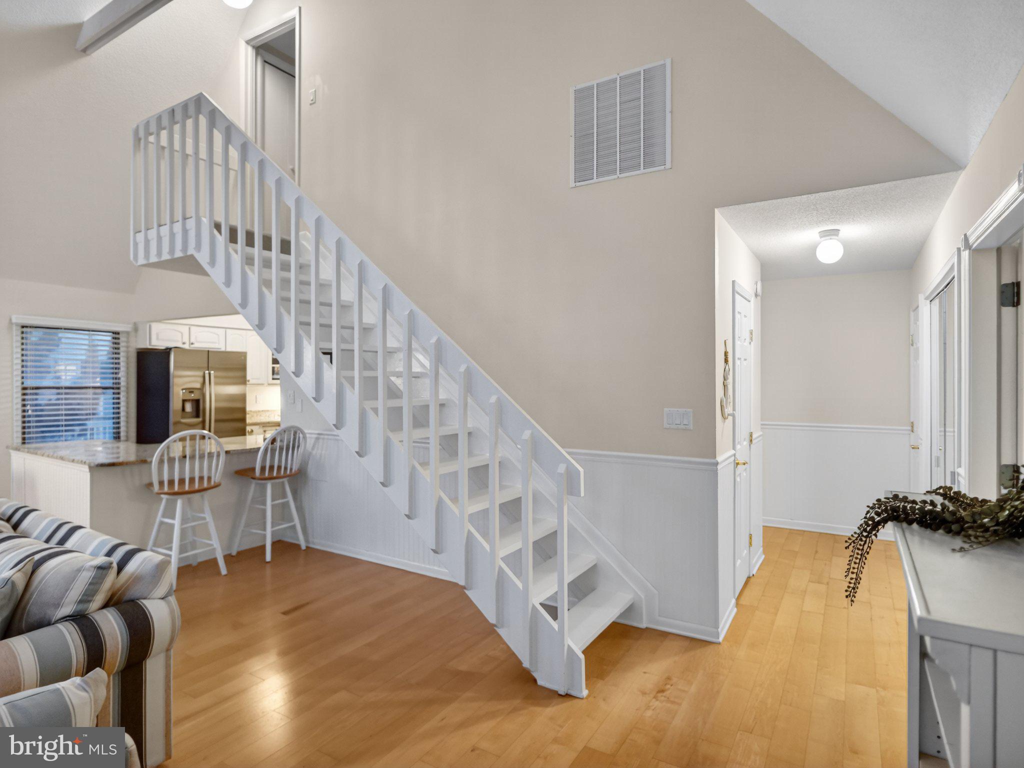 103 Channel Buoy Road Ocean City, MD 21842 - Photo 15 of 29 Bright and airy entryway with stairs.