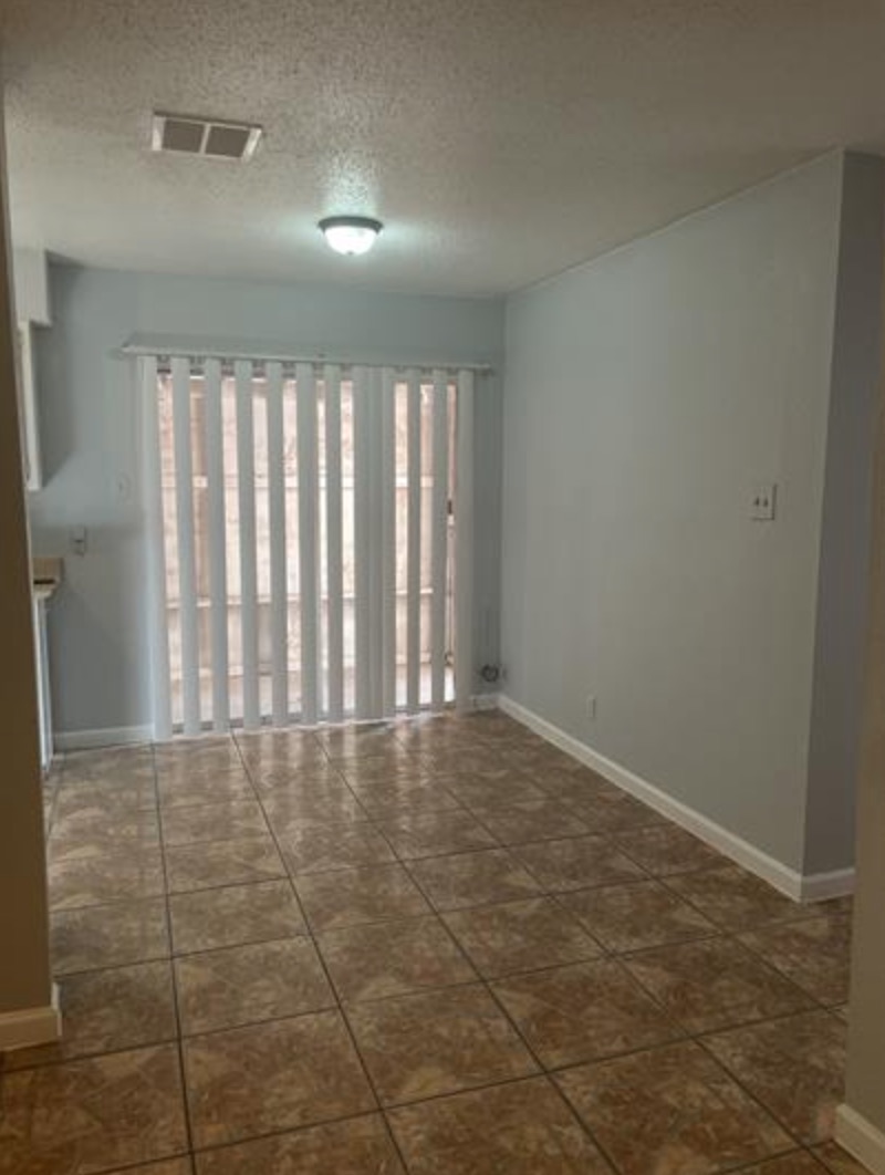 105 Cockerham Street, Unit A Kyle, TX 78640 - Photo 4 of 9 a view of an empty room and window