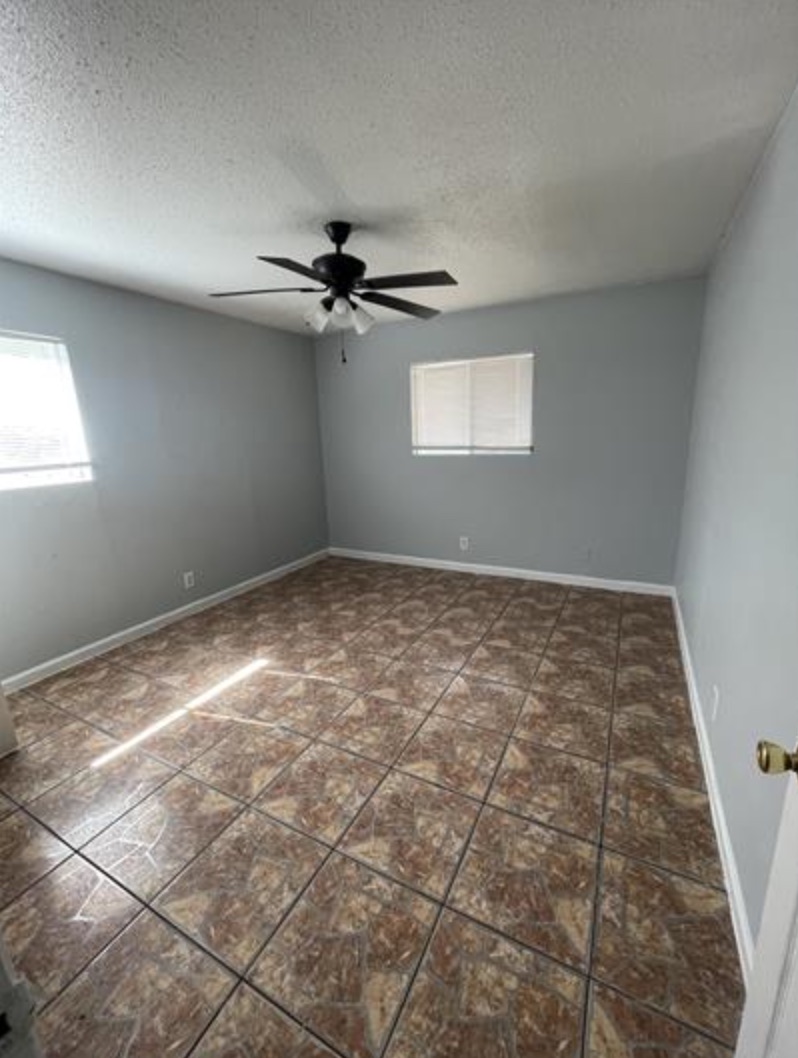 105 Cockerham Street, Unit A Kyle, TX 78640 - Photo 6 of 9 an empty room with a windows