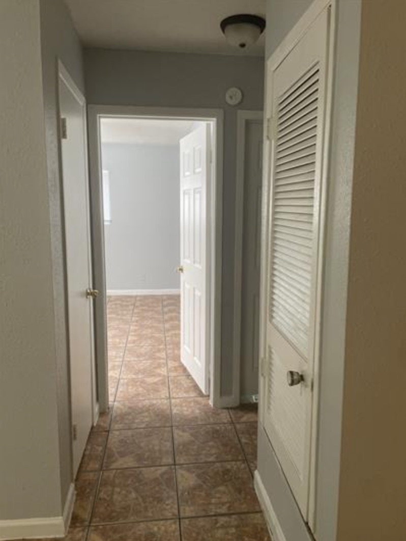 105 Cockerham Street, Unit A Kyle, TX 78640 - Photo 8 of 9 a view of a hallway