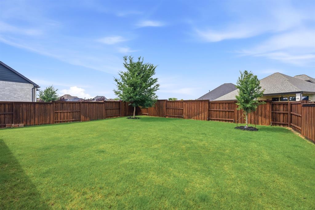 1632 Cotton Road Van Alstyne, TX 75495 - Photo 25 of 40 a view of a backyard with green space