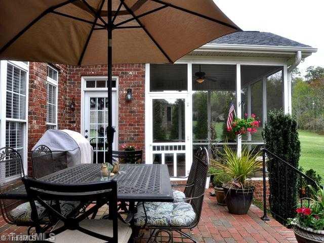 4902 Robdot Drive Oak Ridge, NC 27310 - Photo 13 of 16 Patio/Deck. A brick patio as well! Plenty of room to grill with a door directly into the house. Carolina Jasmine filled trellis on the other end.