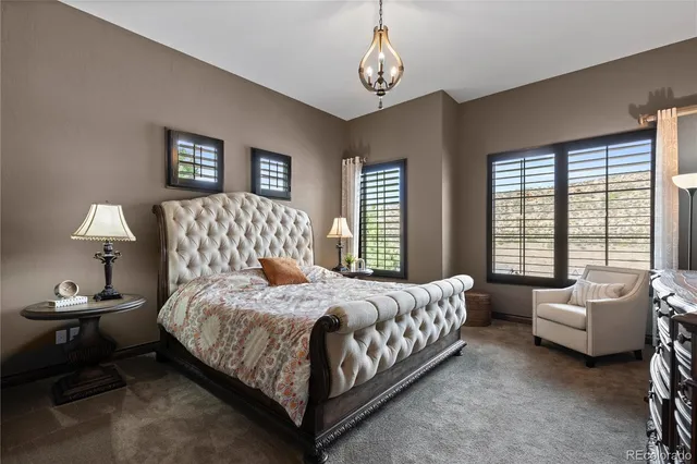 a bedroom with a bed and a couch