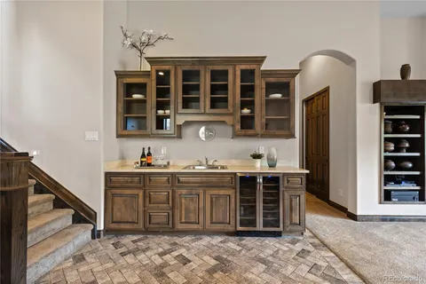 a kitchen with stainless steel appliances granite countertop a stove and cabinets
