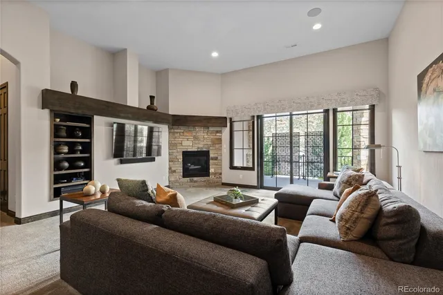 a living room with furniture window and a fireplace