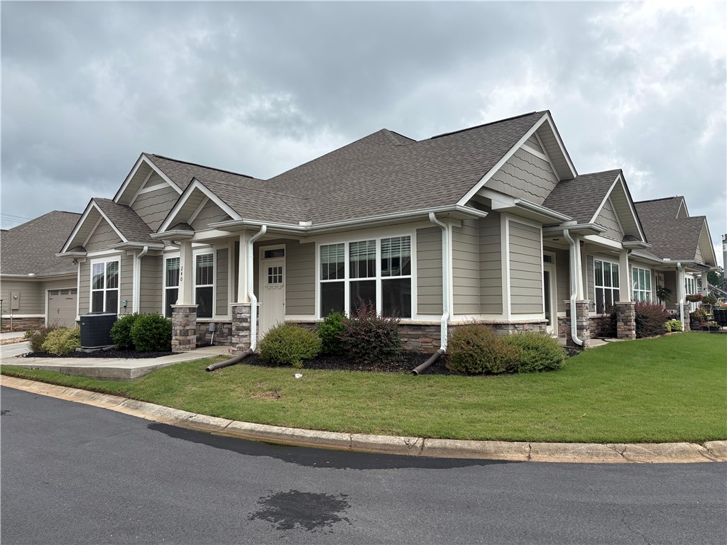 240 Meridian Way Seneca, SC 29672 - Photo 1 of 19 A graceful exterior presents appealing architectural details, including stone accents and well-kept landscaping.