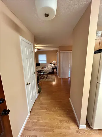 a view of a hallway view with floor to ceiling window and stairs