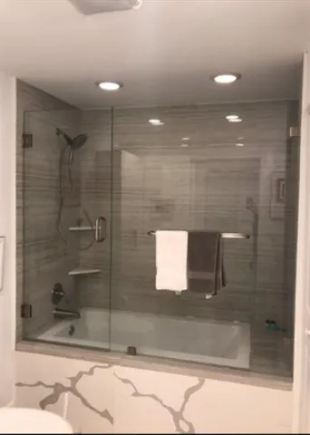 a bathroom with a sink and mirror