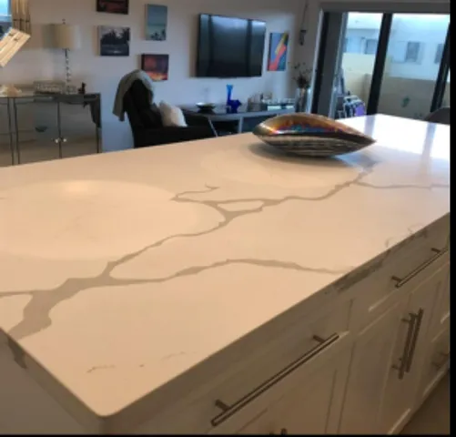 a kitchen with stainless steel appliances a stove microwave and refrigerator